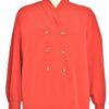 Red blouse with pearl buttons