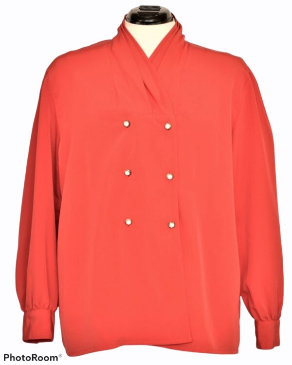 Red blouse with pearl buttons
