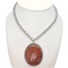 Red semi-precious stone medallion kee