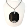 Necklace with large dark pendant